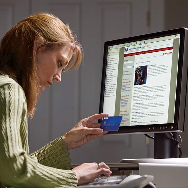 Customer using Visa card to make a secure online shopping purchase