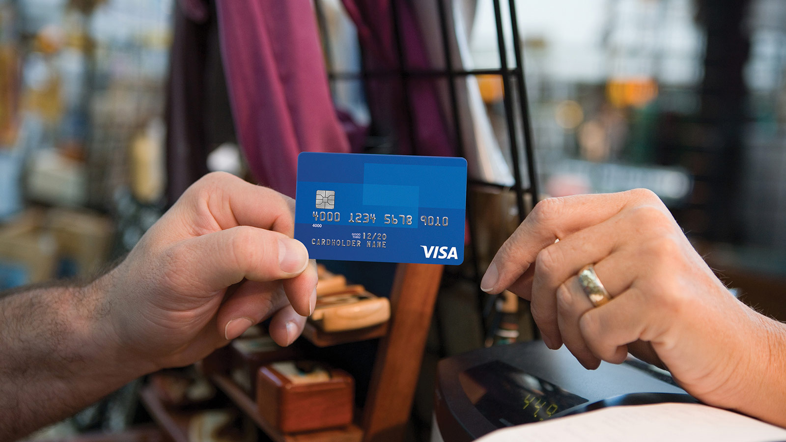 Customer making a secure purchase with a Visa EMV chip card