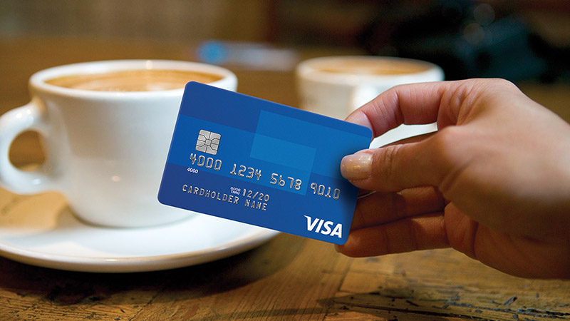 Customer buying a coffee using a Visa chip card